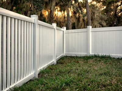 This image shows a white wooden fence for a backyard.